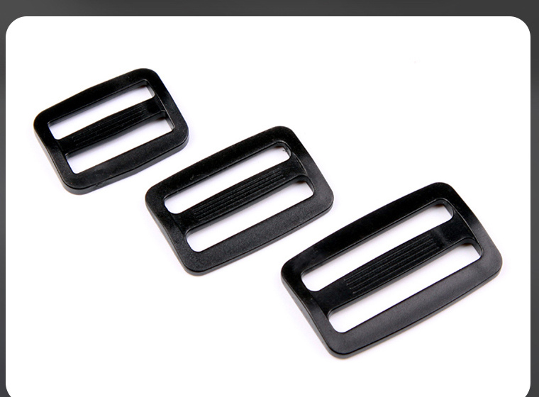 Three rectangular black webbing adjusters in different sizes