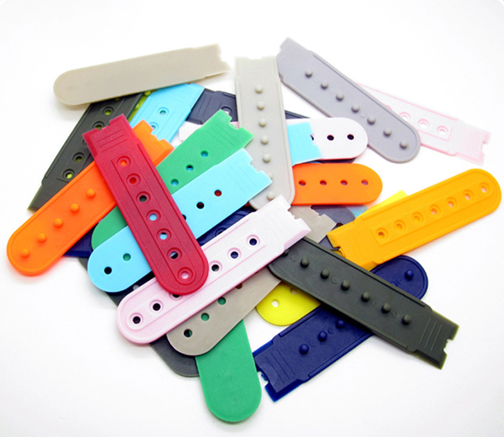 Assorted cap strap adjusters with different snap and hole arrangements