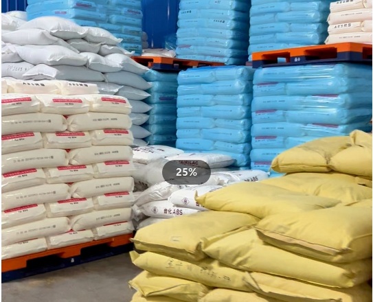 Bags of finished plastic buckle products stacked in warehouse
