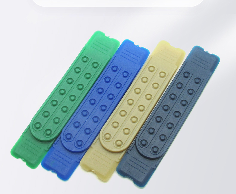 Four PE seven-hole cap strap adjusters in green, blue, cream and charcoal